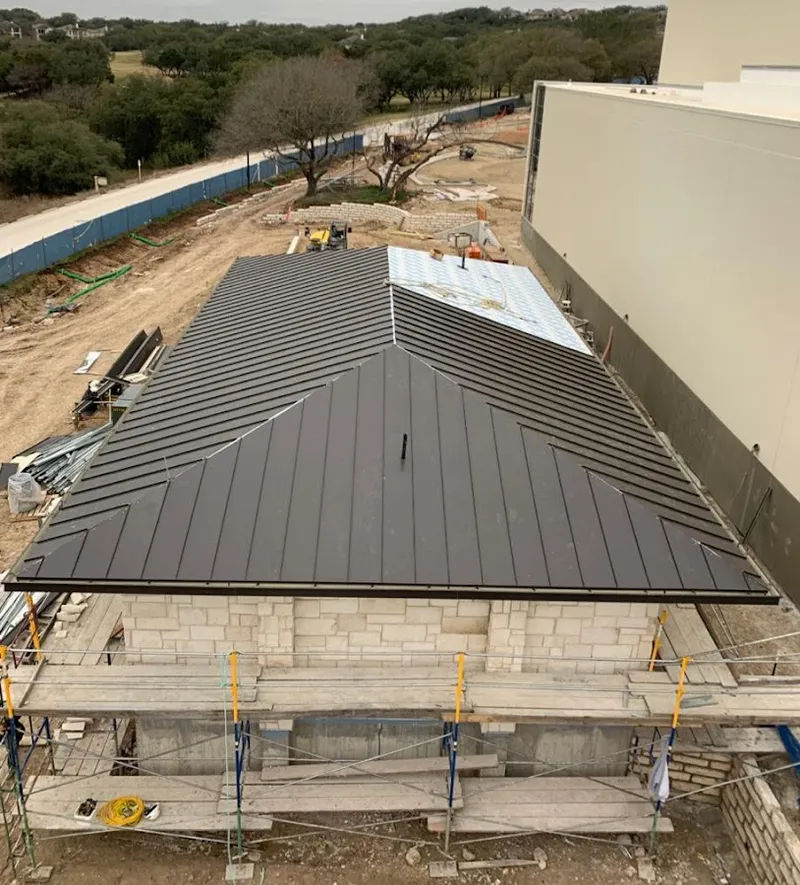 Metal roof new construction with scaffolding in Longview